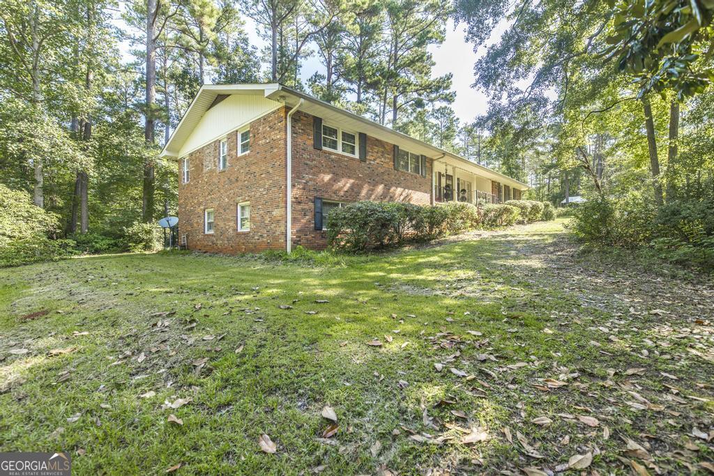 169 Stagecoach Road Macon, GA 31211 - Photo 1 of 1 a view of a house with a yard