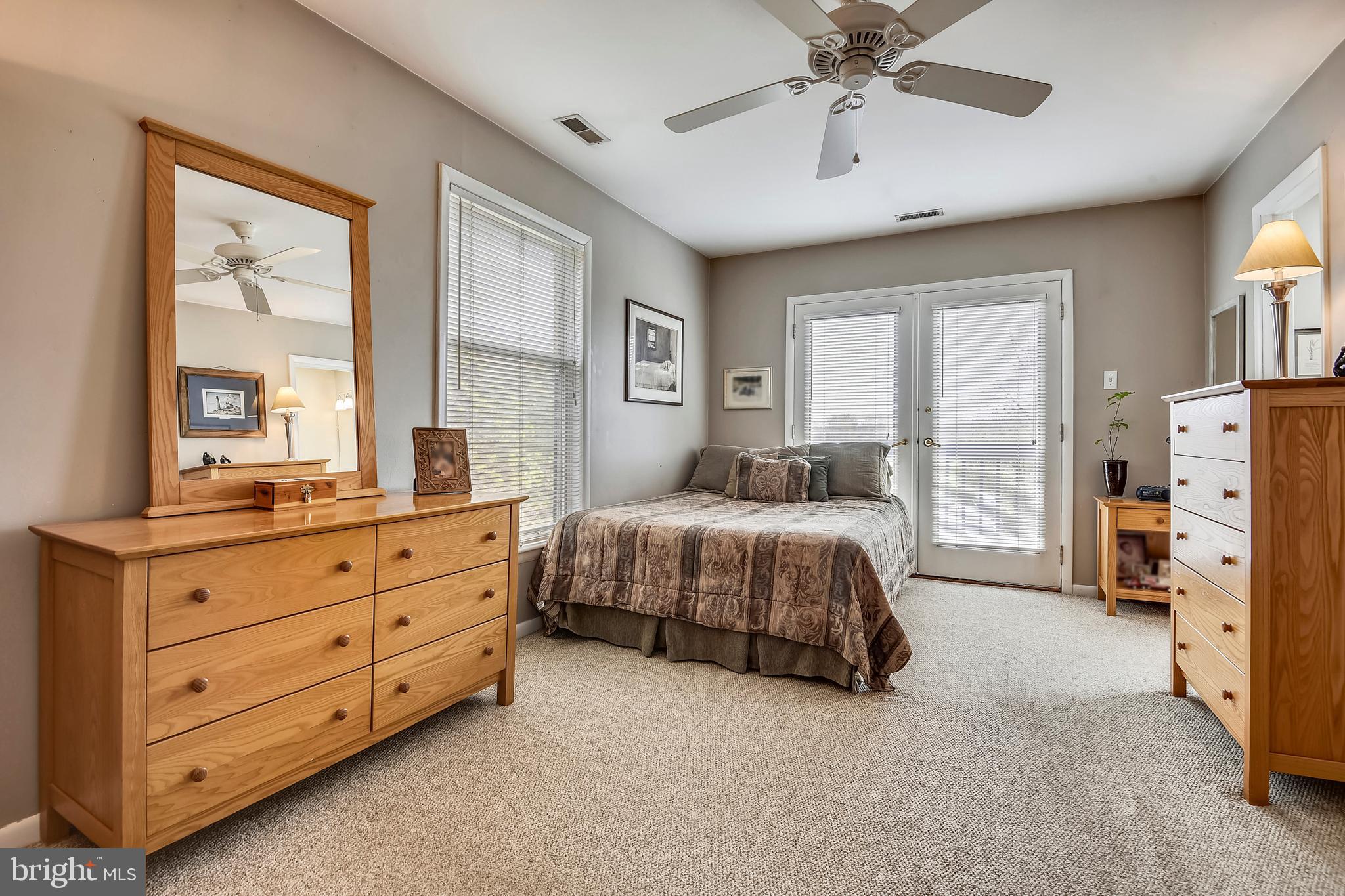 19933 Middletown Road Freeland, MD 21053 - Photo 17 of 36 a spacious bedroom with a bed and a chandelier