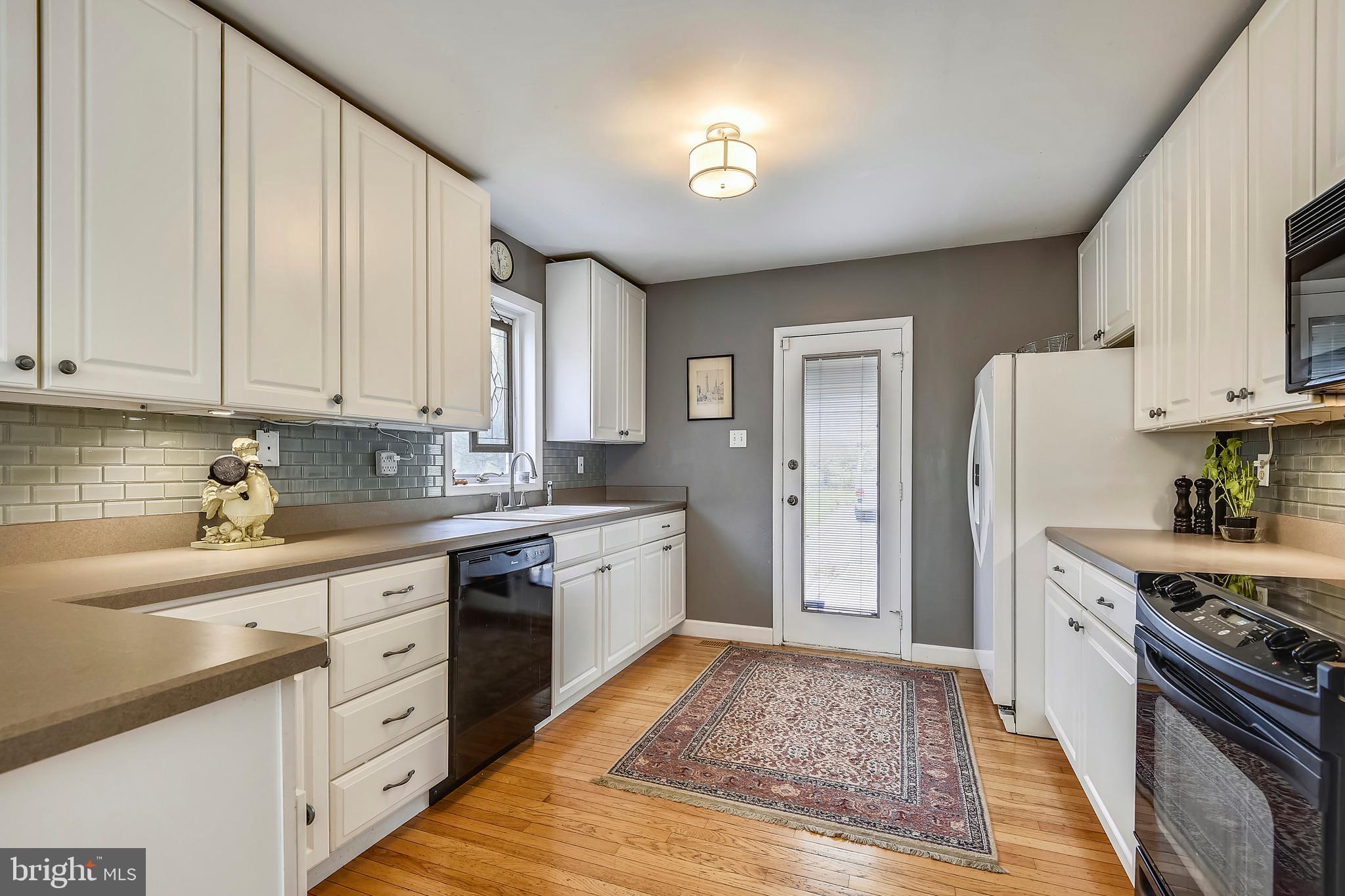19933 Middletown Road Freeland, MD 21053 - Photo 6 of 36 a kitchen with stainless steel appliances granite countertop a refrigerator sink and cabinets