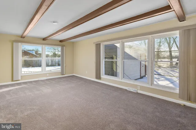 a kitchen with stainless steel appliances granite countertop a sink a stove and a microwave