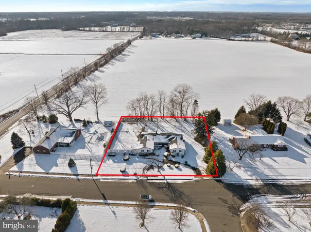 a view of a house with a flower garden