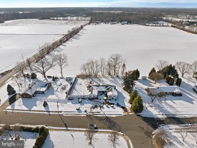 an empty room with fireplace and windows