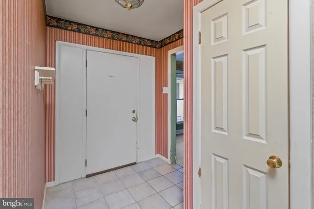 a kitchen with kitchen island granite countertop a sink cabinets and stainless steel appliances