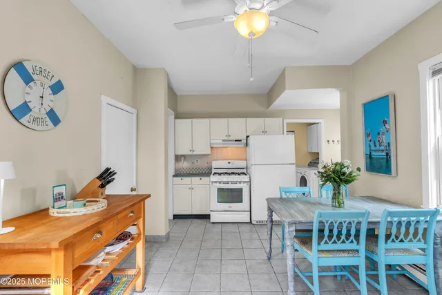 a kitchen with a table and chairs in it