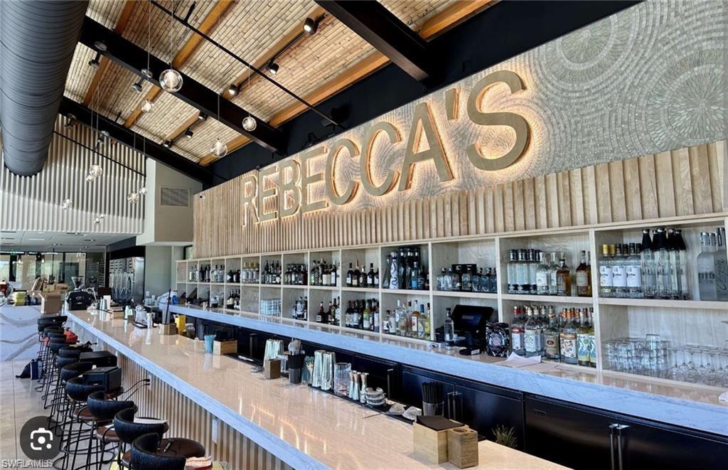 0 Bayshore Drive Naples, FL 34112 - Photo 16 of 18 a kitchen with lots of bottles of alcohol