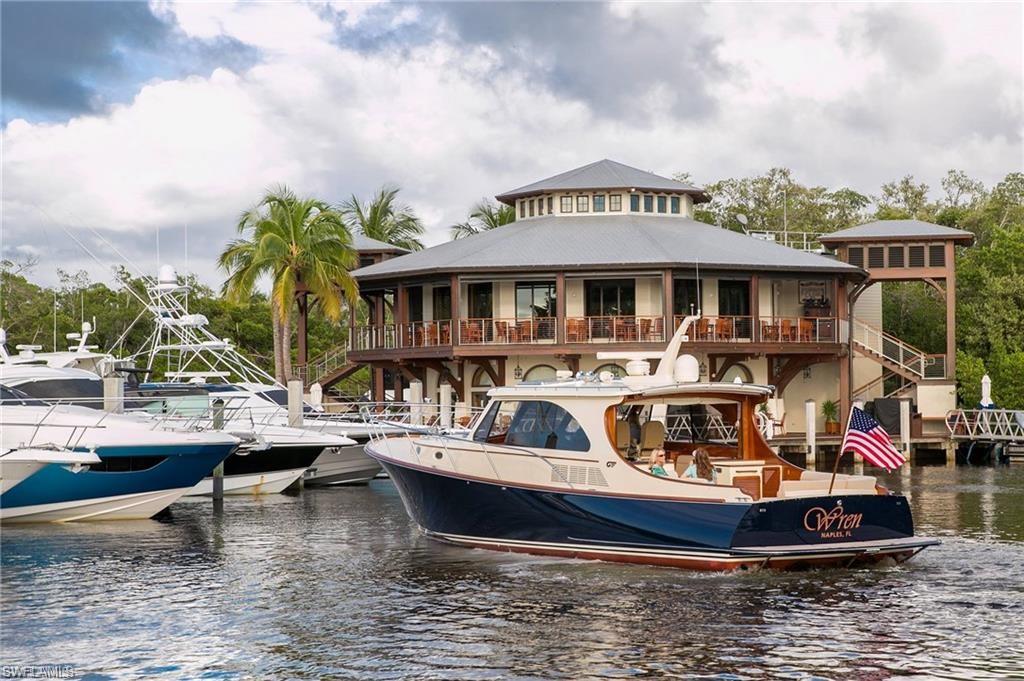0 Bayshore Drive Naples, FL 34112 - Photo 4 of 18 a large building with an outdoor seating