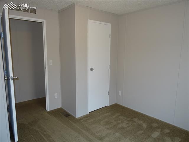 3405 Sinton Road, Unit 233 Colorado Springs, CO 80907 - Photo 17 of 22 Closet in 2nd bedroom and door to hall