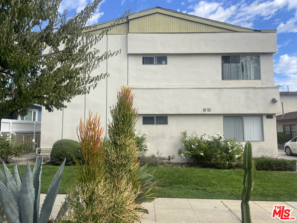 1150 North Commonwealth Avenue, Unit 1 Los Angeles, CA 90029 - Photo 2 of 11 a view of a house with a yard