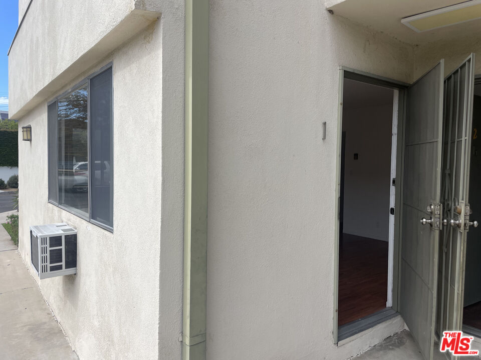 1150 North Commonwealth Avenue, Unit 1 Los Angeles, CA 90029 - Photo 3 of 11 a view of a hallway with wooden floor and entryway