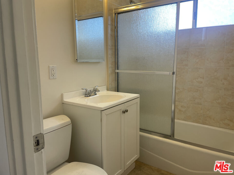 1150 North Commonwealth Avenue, Unit 1 Los Angeles, CA 90029 - Photo 9 of 11 a bathroom with a sink toilet and shower