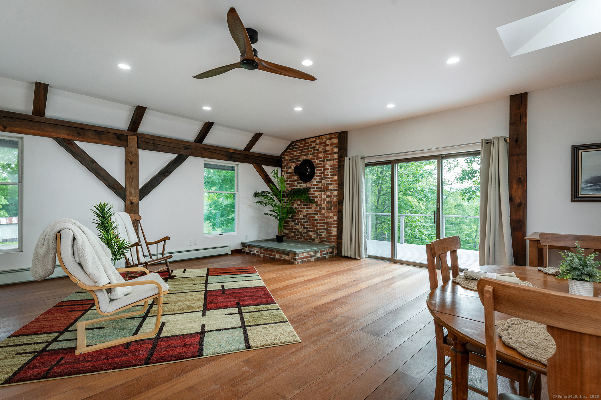 178 Carter Road Kent, CT 06754 - Photo 12 of 37 a living room with furniture floor to ceiling window and wooden floor