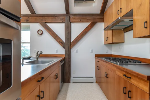 a view of a kitchen with electric appliances