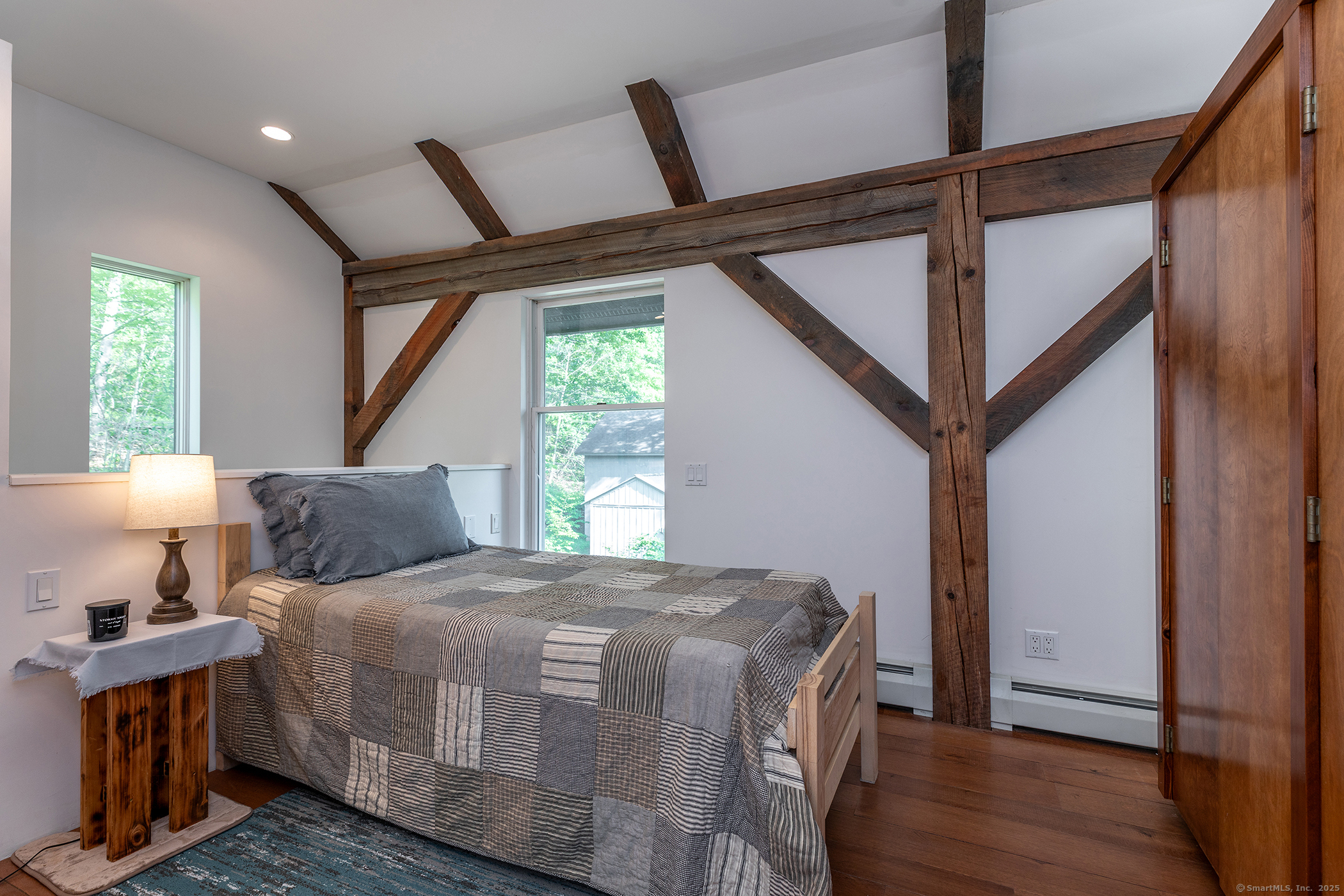 178 Carter Road Kent, CT 06754 - Photo 21 of 37 a bedroom with bed and wooden floor