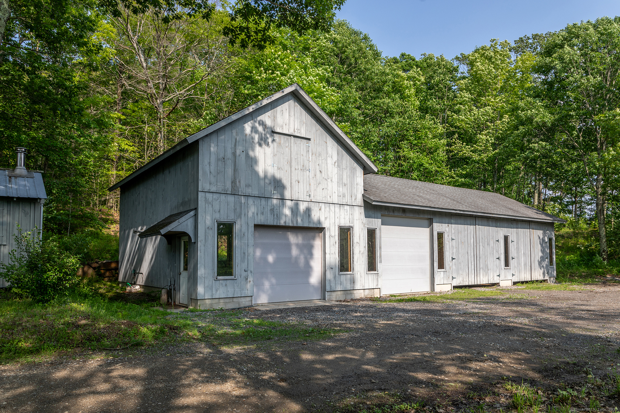 178 Carter Road Kent, CT 06754 - Photo 27 of 37 a view of a wooden house with a yard
