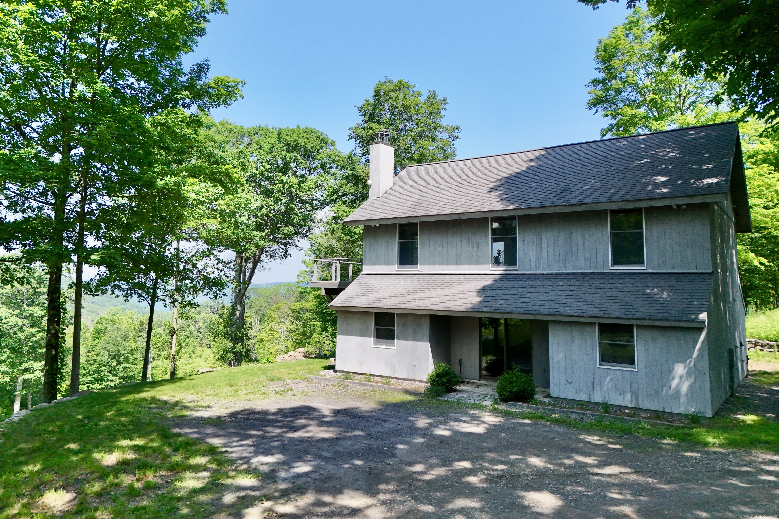 178 Carter Road Kent, CT 06754 - Photo 5 of 37 a front view of a house with a garden