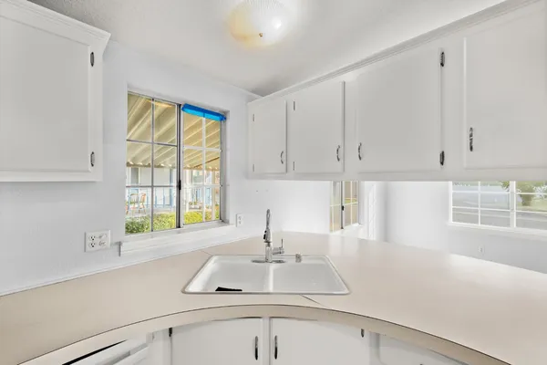 a kitchen with a sink and a window