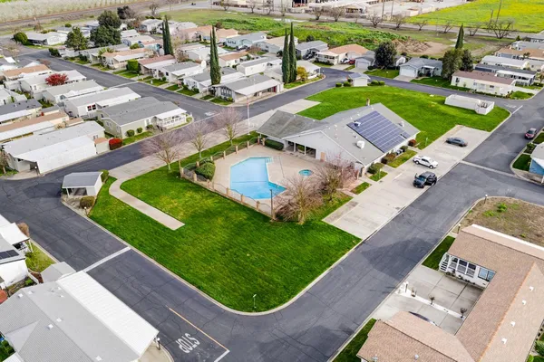 an aerial view of a house with a garden