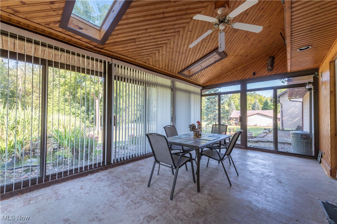 1820 Claus Road Vermilion, OH 44089 - Photo 10 of 10 Unfurnished sunroom with ceiling fan and vaulted ceiling with skylight
