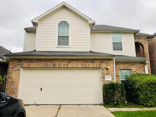 a view of a house with garage