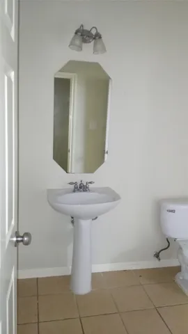 a bathroom with a shower and a toilet