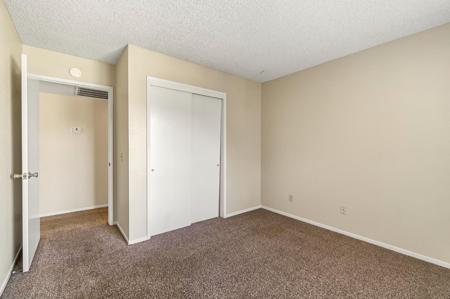 3837 North State Street Fresno, CA 93722 - Photo 20 of 33 a view of an empty room and closet area