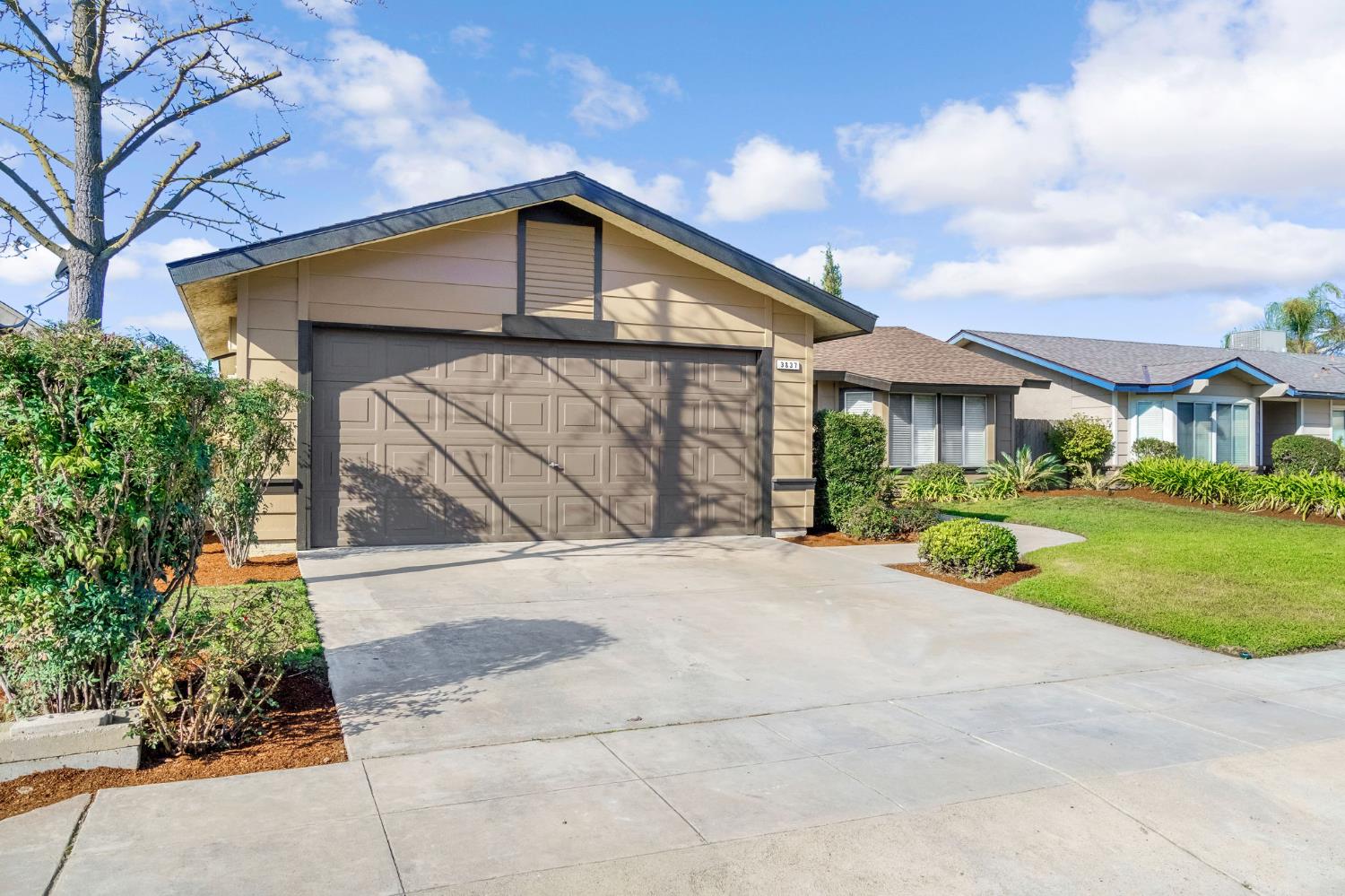3837 North State Street Fresno, CA 93722 - Photo 3 of 33 a front view of a house with a yard