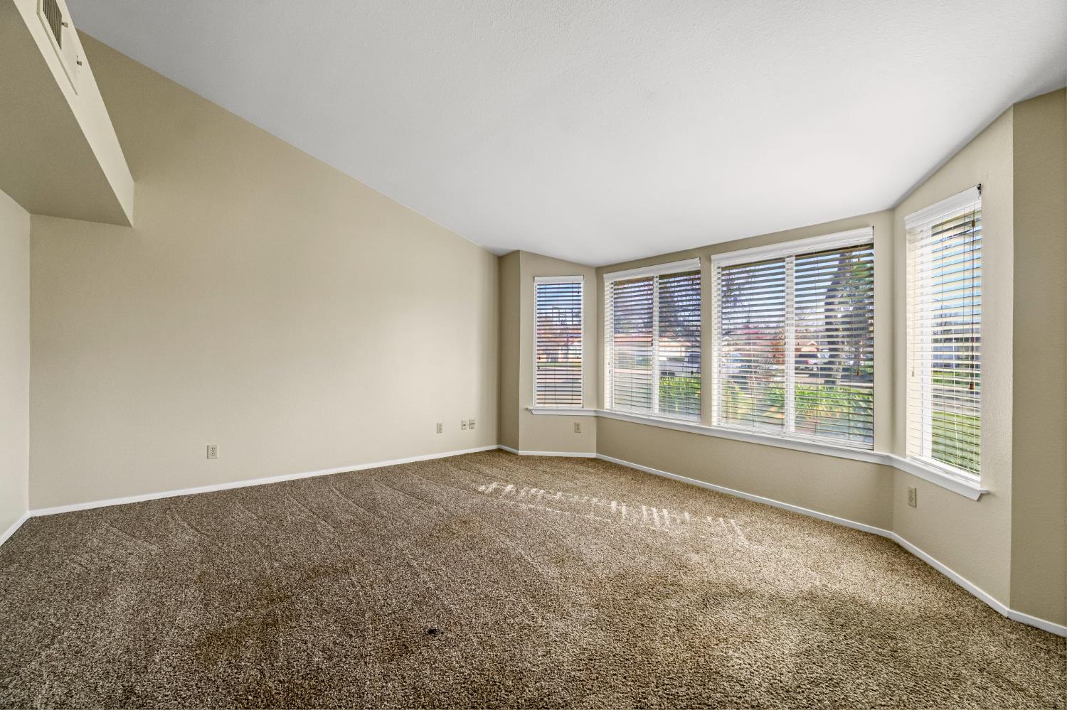 3837 North State Street Fresno, CA 93722 - Photo 7 of 33 a view of an empty room with a window