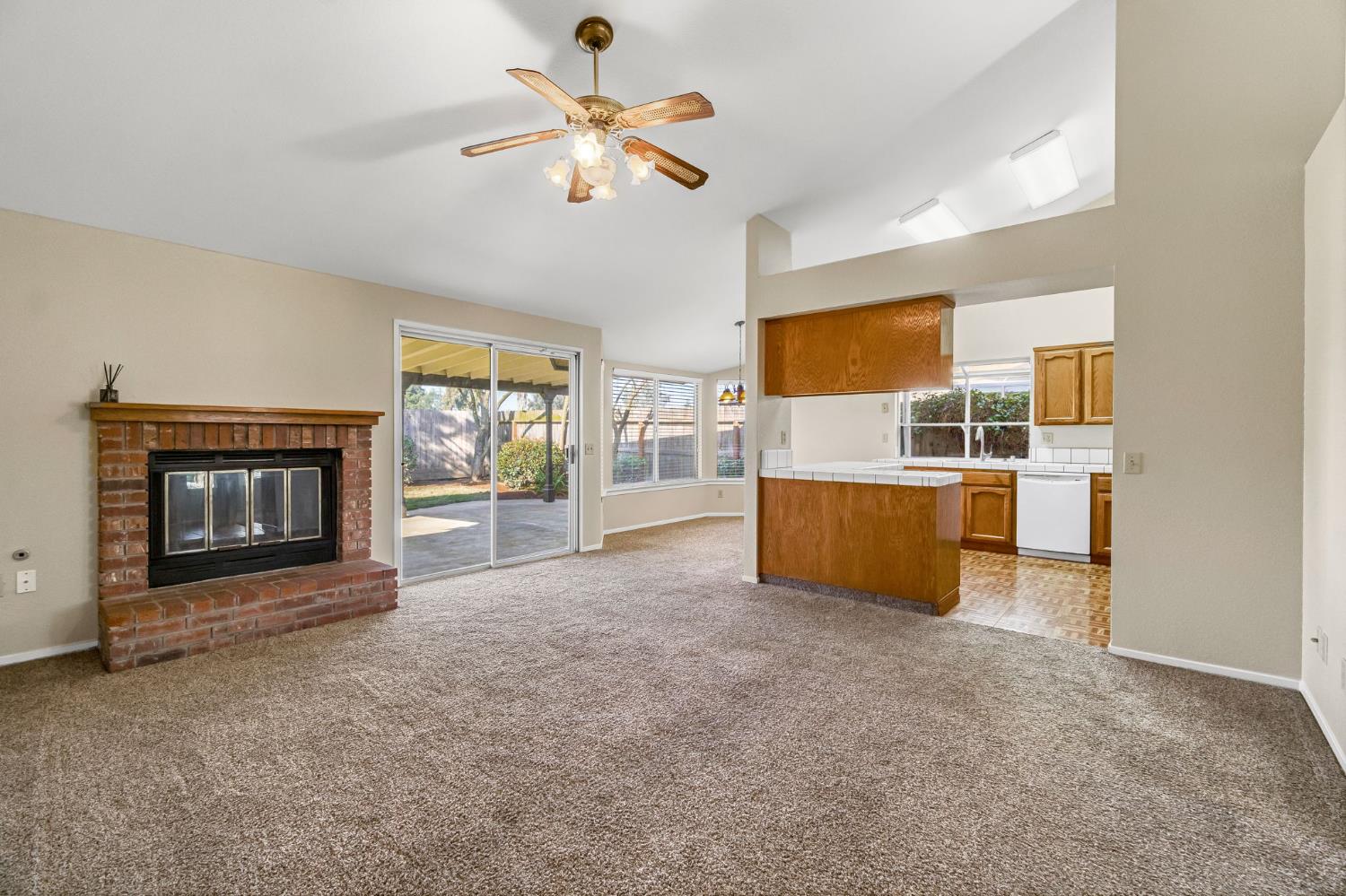 3837 North State Street Fresno, CA 93722 - Photo 9 of 33 a living room with furniture and a fireplace