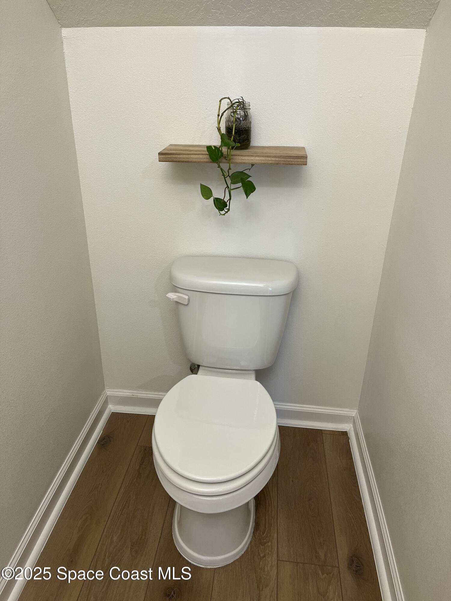 95 Montecito Drive Satellite Beach, FL 32937 - Photo 17 of 20 a bathroom with a toilet and a shower