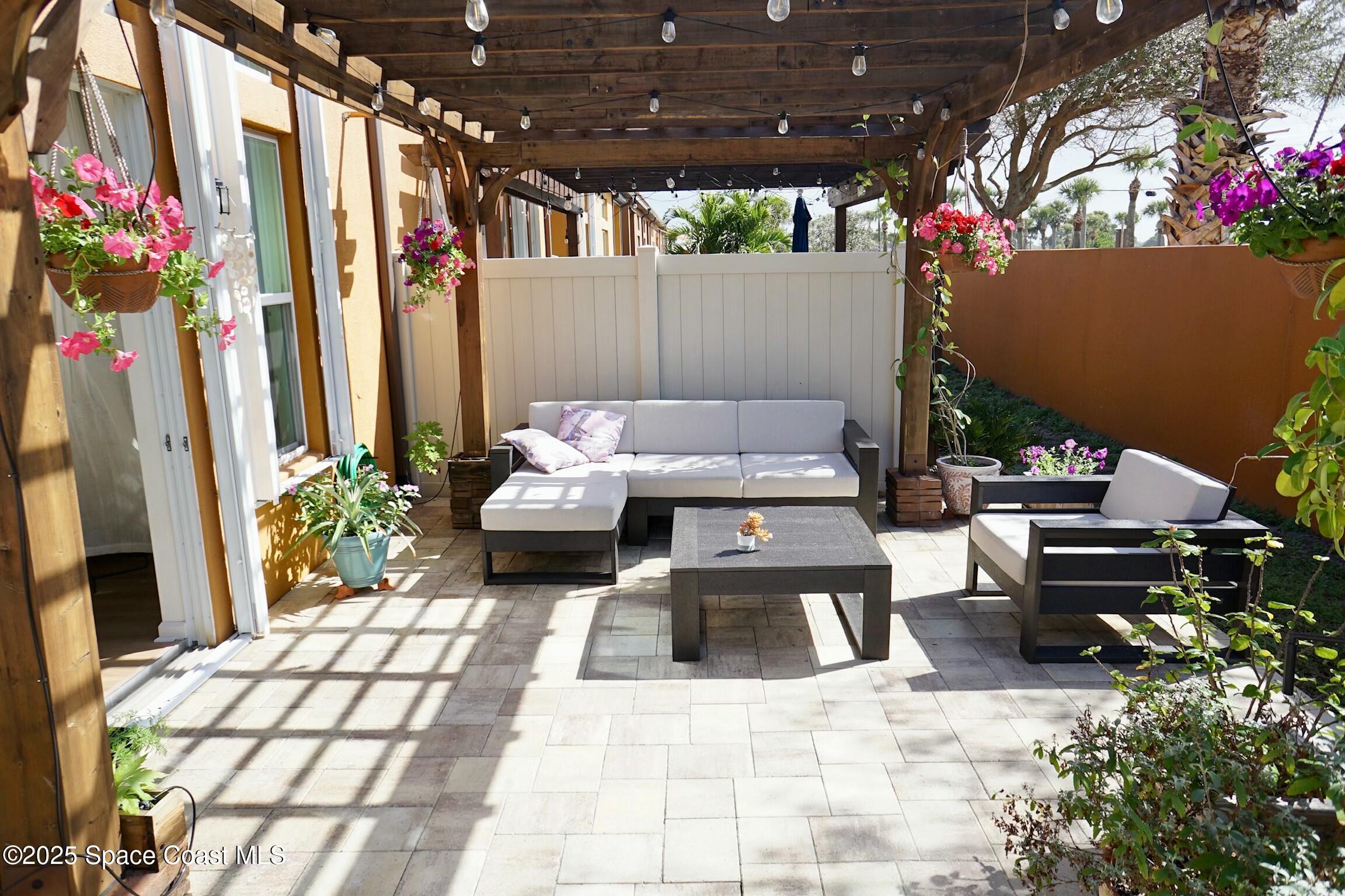 95 Montecito Drive Satellite Beach, FL 32937 - Photo 20 of 20 a view of a chairs and tables in the patio