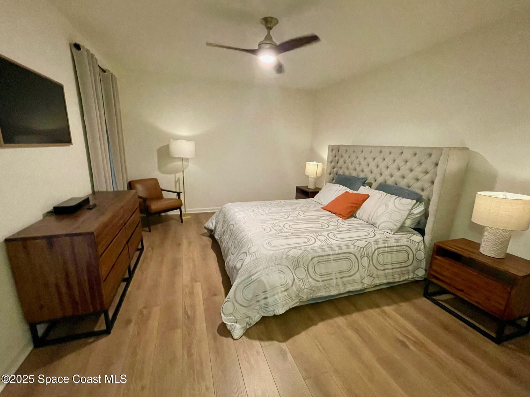 95 Montecito Drive Satellite Beach, FL 32937 - Photo 3 of 20 a bedroom with a bed and a flat screen tv