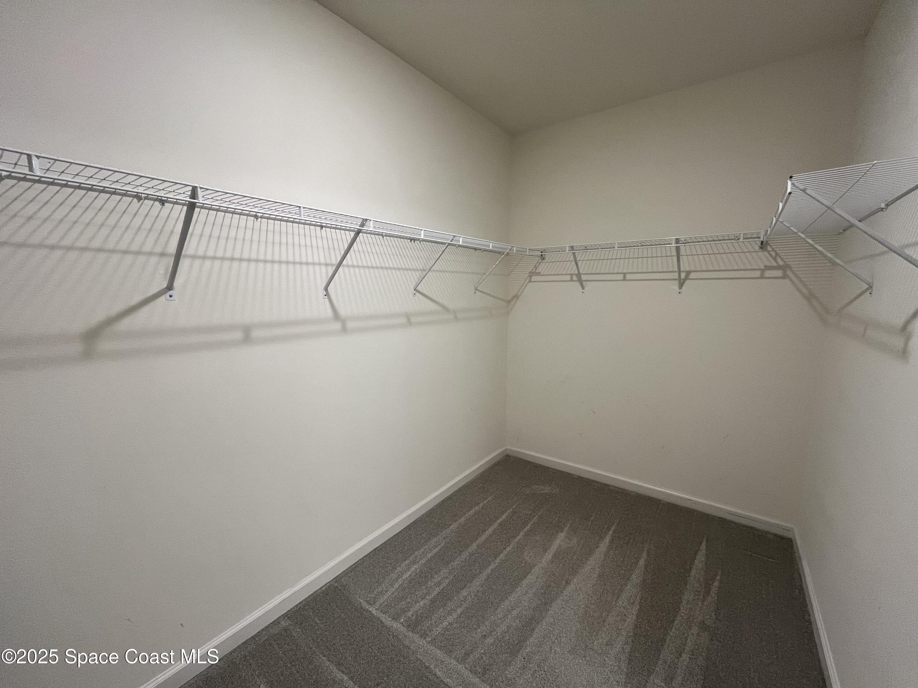 95 Montecito Drive Satellite Beach, FL 32937 - Photo 5 of 20 a view of a room with racks on the wall