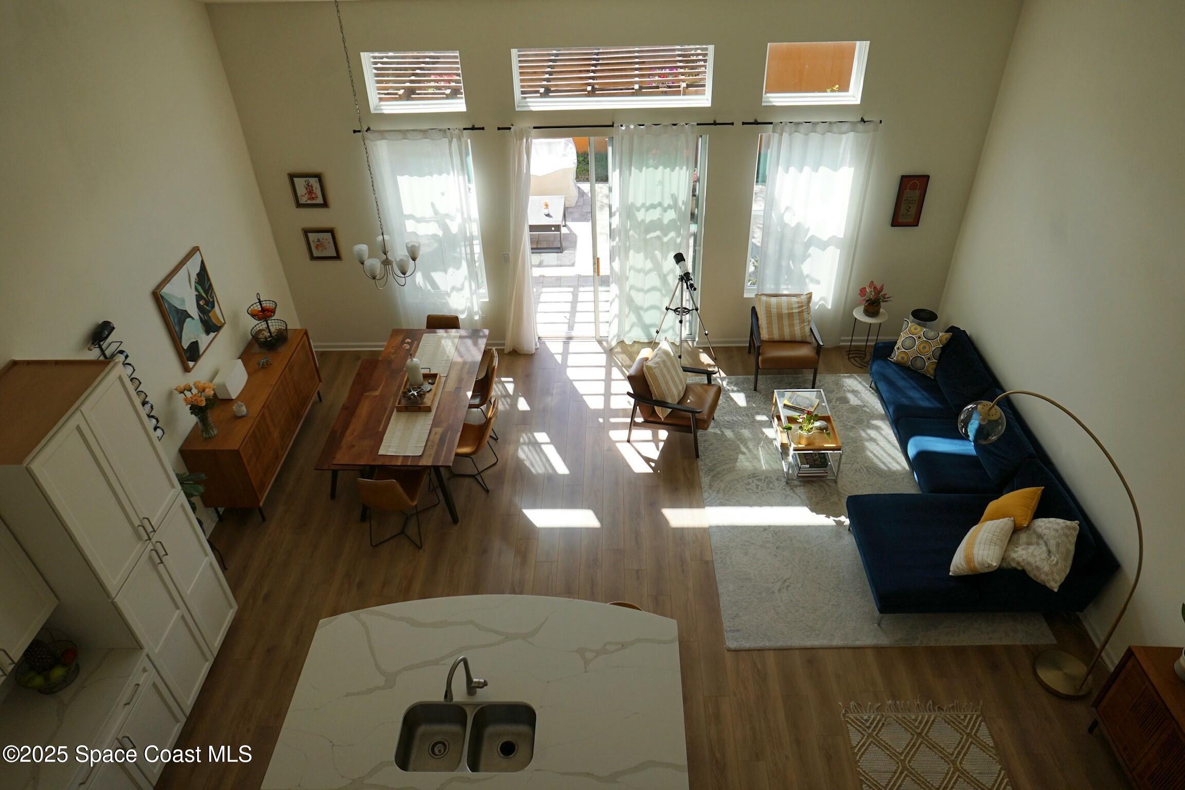 95 Montecito Drive Satellite Beach, FL 32937 - Photo 7 of 20 a living room with furniture and wooden floor