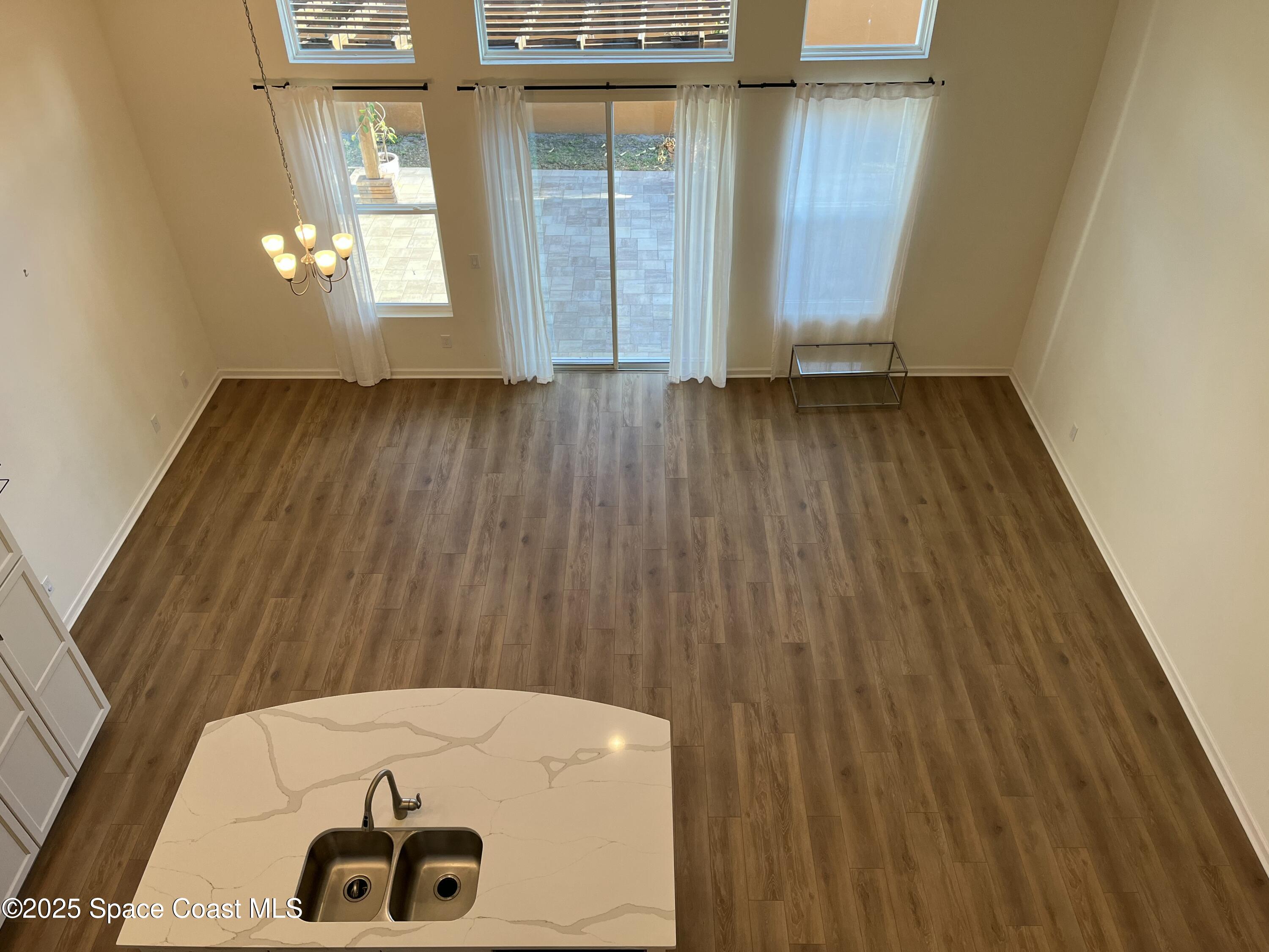 95 Montecito Drive Satellite Beach, FL 32937 - Photo 8 of 20 a view of an entryway with wooden floor