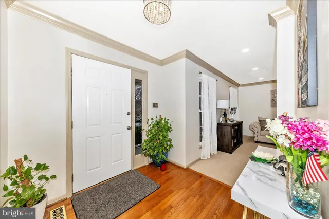 a bedroom with furniture and a potted plant