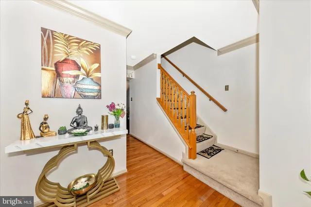 a view of a hallway with furniture and entryway