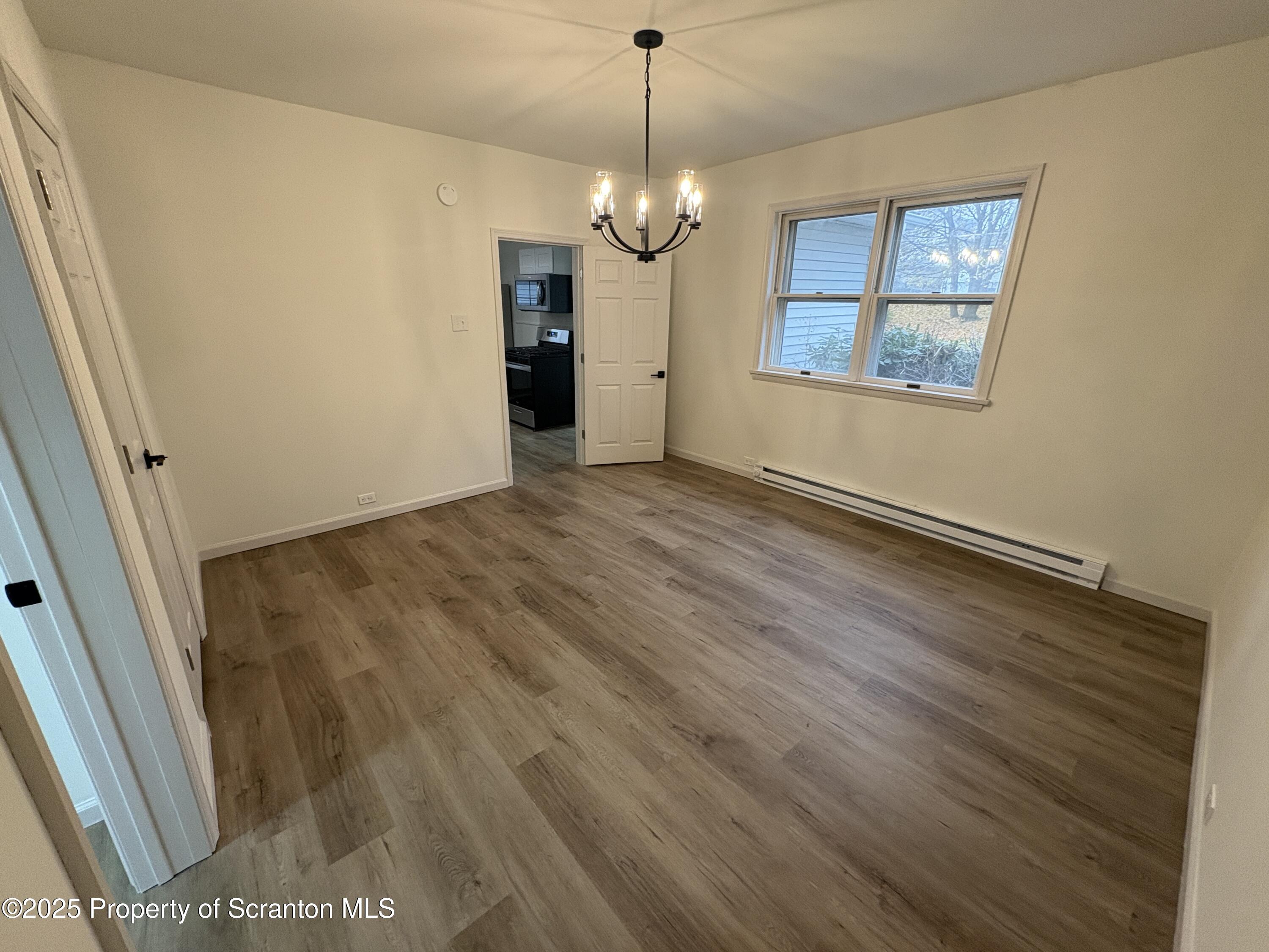115 West Warren Street Dunmore, PA 18512 - Photo 19 of 36 a view of an empty room with a window