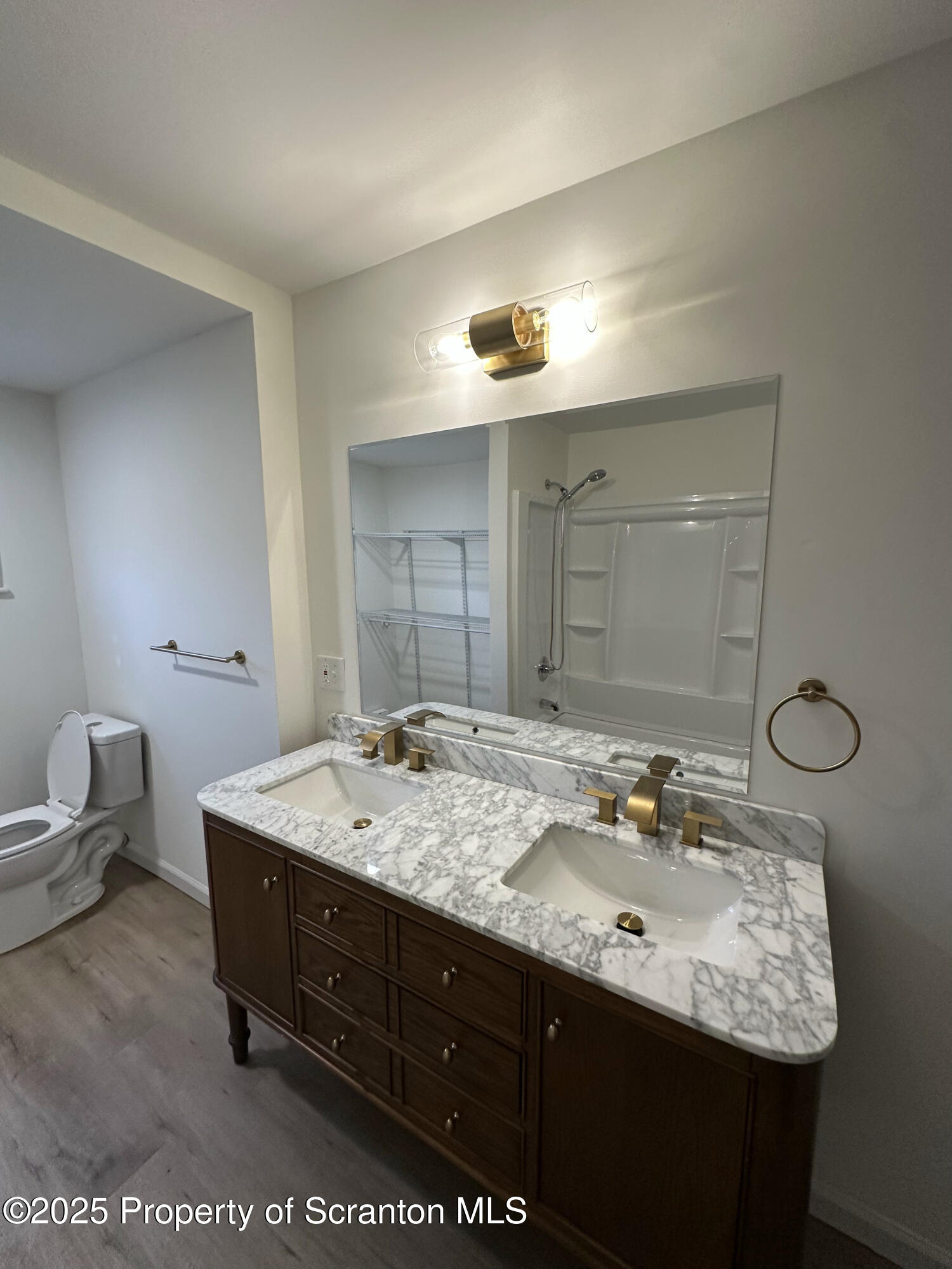 115 West Warren Street Dunmore, PA 18512 - Photo 22 of 36 a en suite bathroom with a granite countertop sink and a mirror