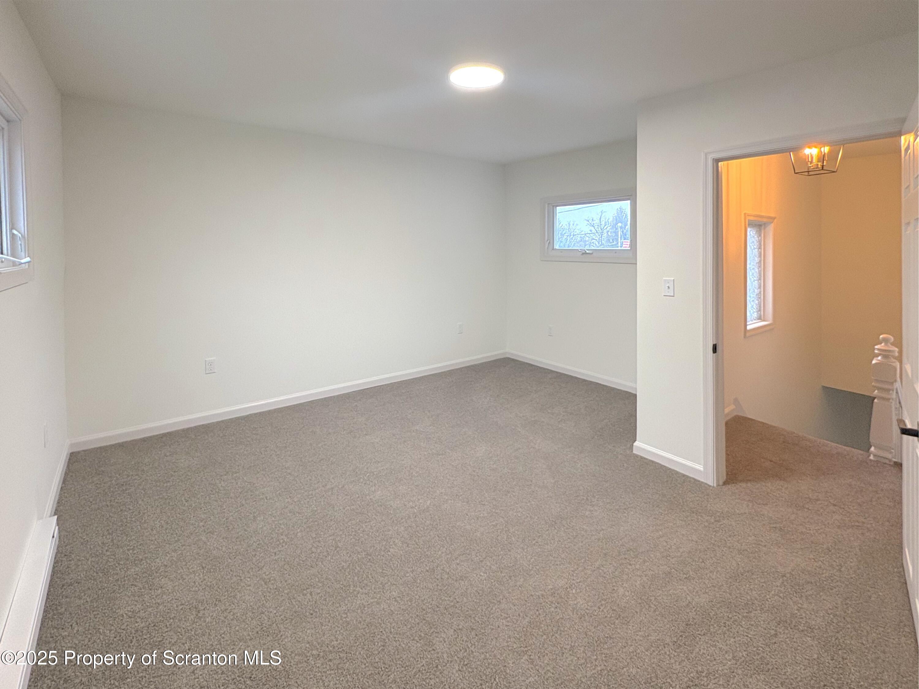 115 West Warren Street Dunmore, PA 18512 - Photo 26 of 36 an empty room with windows