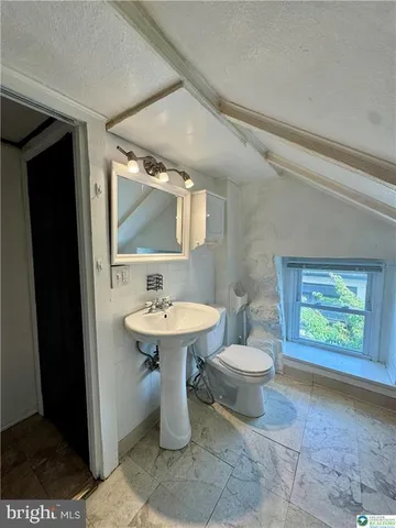 a bathroom with a tub and shower