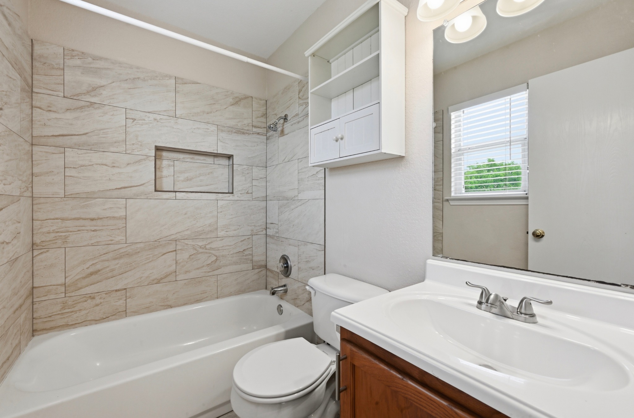 112 Mason Reed Cove Kyle, TX 78640 - Photo 16 of 26 a bathroom with a sink a toilet and shower