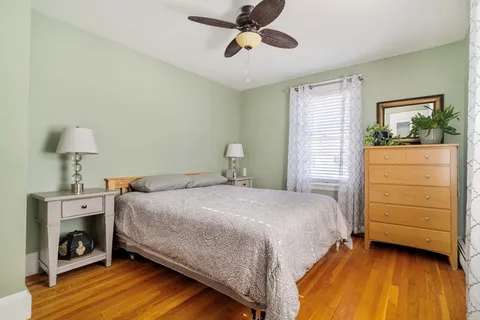 a bedroom with a bed and a fireplace