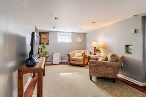 a bedroom with furniture and a window