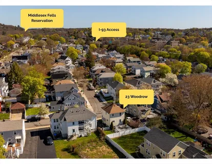 an aerial view of residential houses with swimming pool
