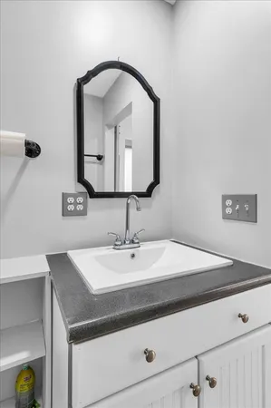 a bathroom with a sink and a mirror