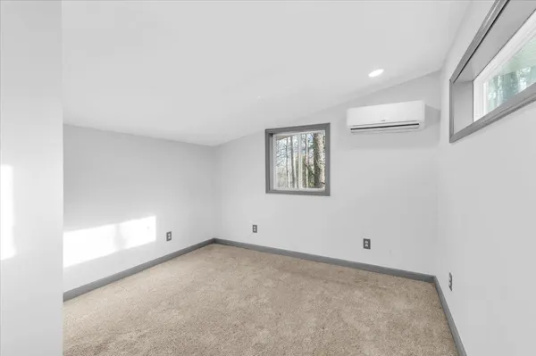 a kitchen with stainless steel appliances a refrigerator and a stove top oven