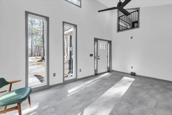 a view of an entryway with wooden floor