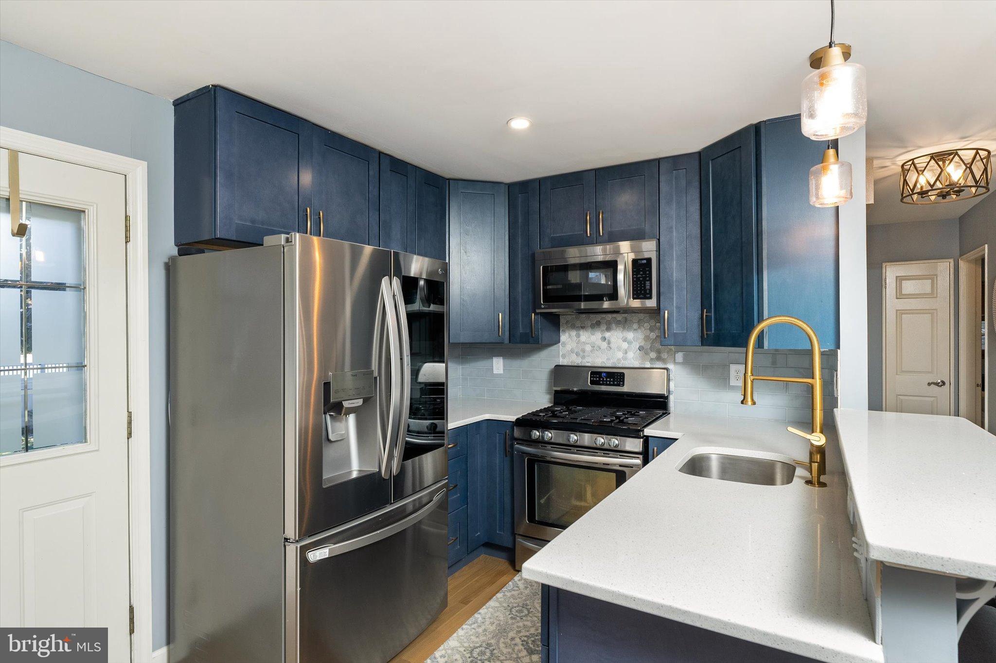 23 Beaumont Road Hamilton, NJ 08620 - Photo 12 of 45 a kitchen with a refrigerator a stove a sink and dishwasher