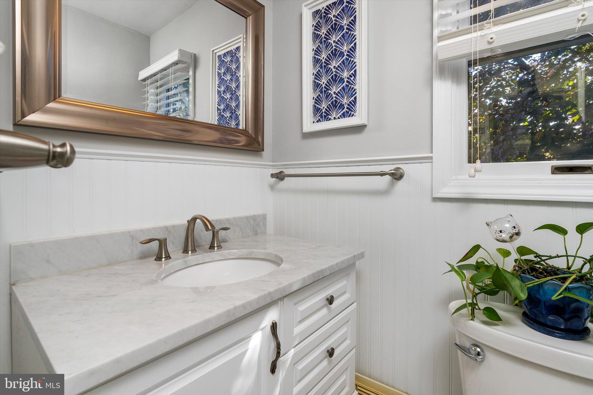 23 Beaumont Road Hamilton, NJ 08620 - Photo 20 of 45 a bathroom with a sink mirror and vanity