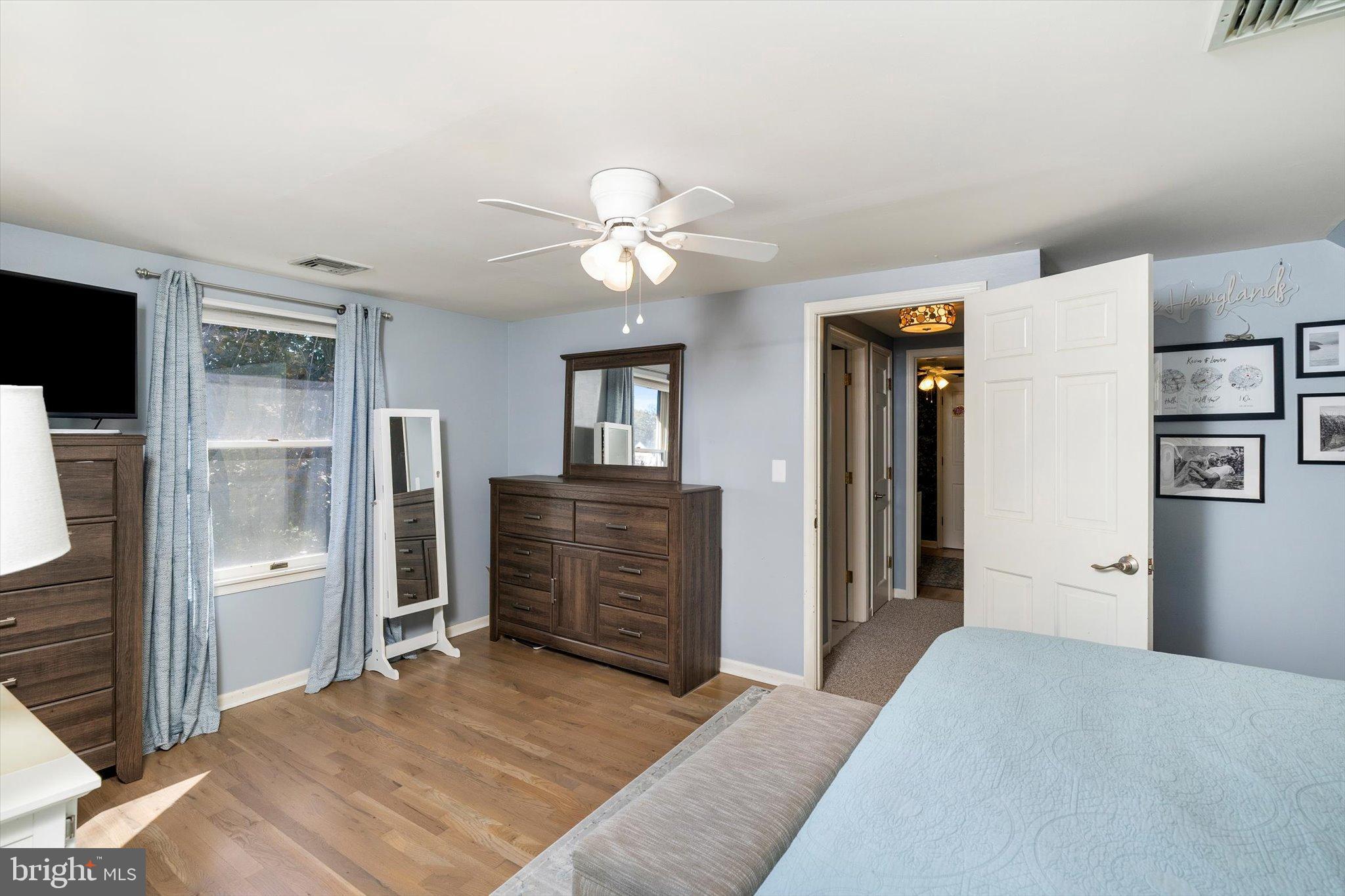 23 Beaumont Road Hamilton, NJ 08620 - Photo 23 of 45 a bedroom with a bed and a chandelier